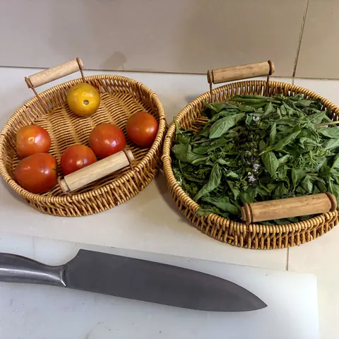 Basket of fresh vegetables and herbs from the garden